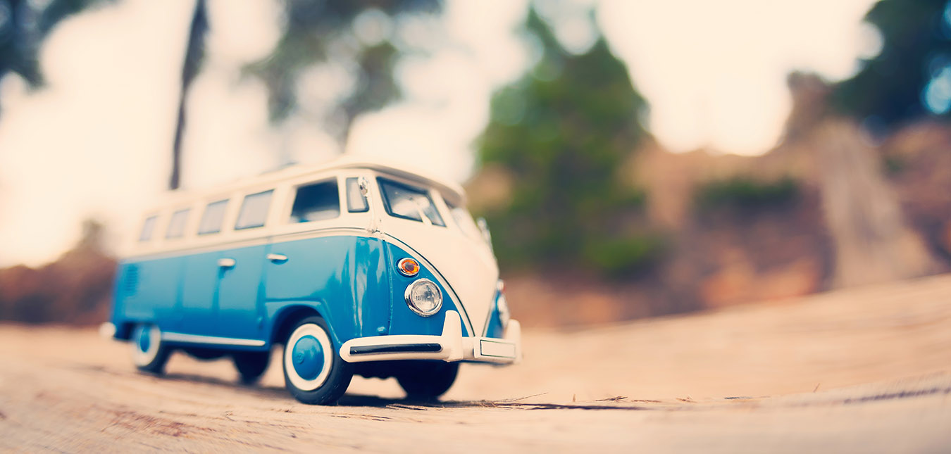 Miniature travelling vintage van. Color tone tuned macro photo